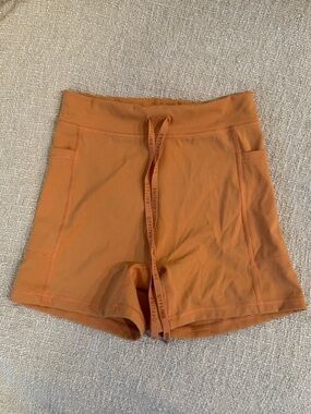 High-Waist Orange Bike Shorts with Drawstring